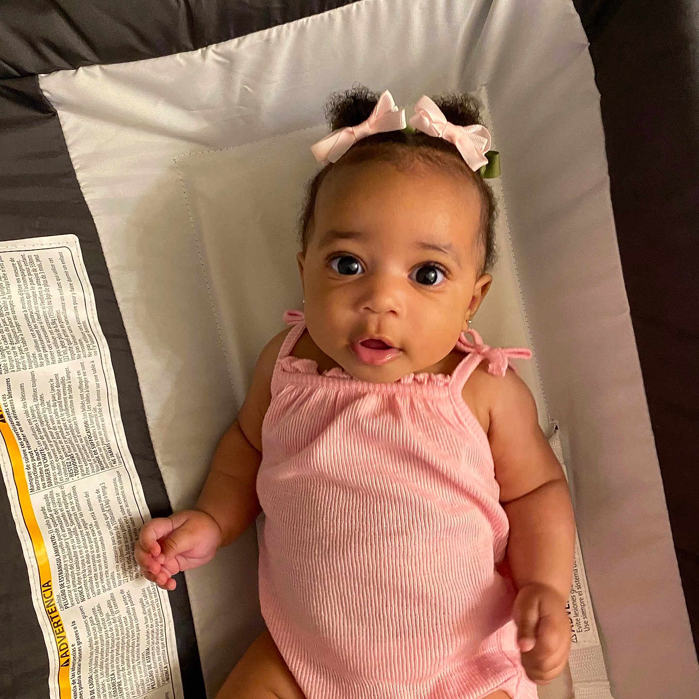 Ava joined the competition — help win amazing prizes! arm, baby, bows, child, comfortable, cushion, cushioned_surface, cute, expression, eyes, face, hair, hand, indoor, infant, lying_down, pink_outfit, portrait, skin, soft_lighting