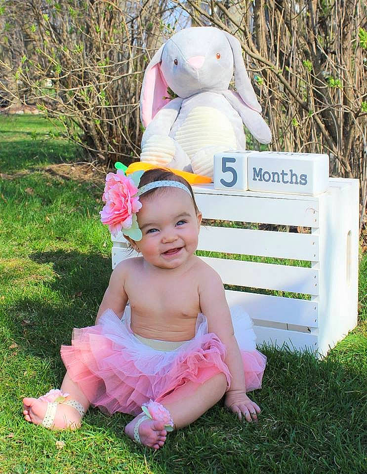 Abrielle is registered to the contest to win money with this photo: baby, baby_toddler_clothing, child, easter_bunny, grass, happy, joy, person, pink, product, smile, toddler