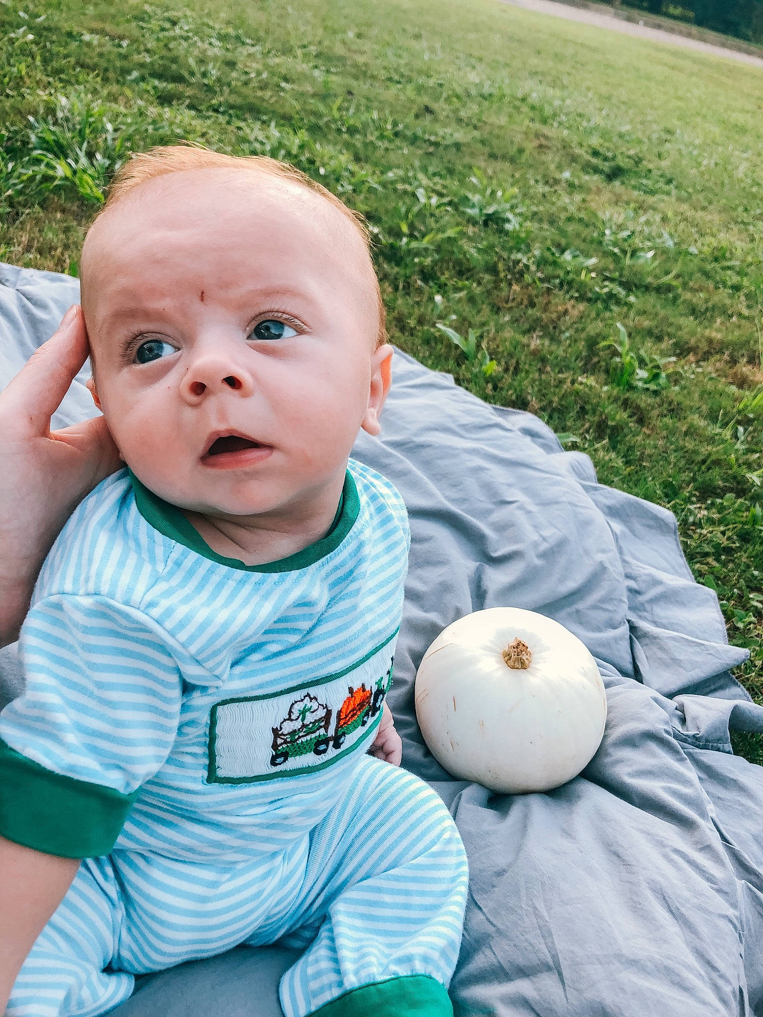 Judson is registered to the contest to win money with this photo: baby, baby_toddler_clothing, ball, calabaza, cheek, child, fun, grass, grass_family, happy, lawn, leisure, people_in_nature, person, plant, recreation, sitting, sports_equipment, t_shirt, toddler