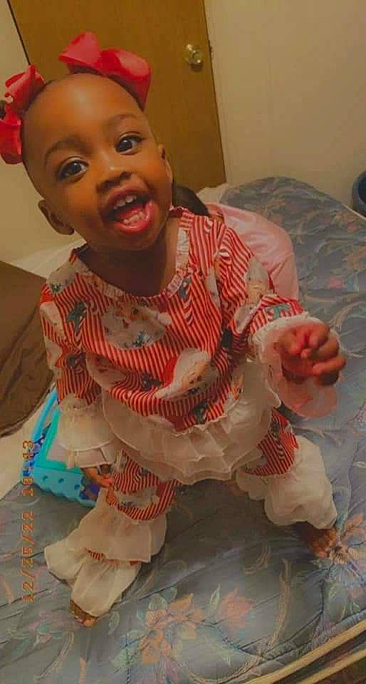 Ja'Kiaha is registered to the contest to win money with this photo: arm, baby, baby_toddler_clothing, cheek, child, chin, dress, eye, face, flooring, forehead, head, lip, mouth, nose, organ, people, person, pink, skin