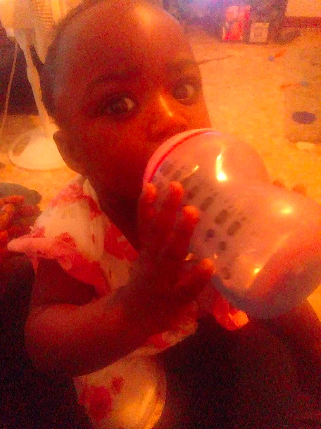 Ja'Kiaha is registered to the contest to win money with this photo: baby, candle, child, darkness, event, facial_hair, finger, fire, flesh, fun, glass, heat, orange, person, room, thumb, toddler, wax