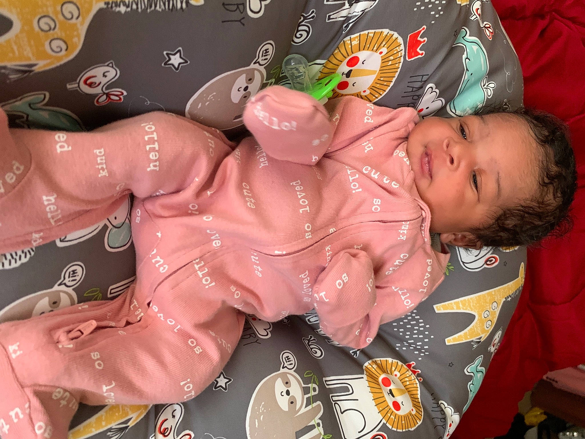 Damiyah is registered to the contest to win money with this photo: arm, baby, baby_products, baby_toddler_clothing, carmine, cheek, child, facial_expression, finger, font, happy, human_body, mouth, nail, pattern, person, pink, sleeve, textile, thigh