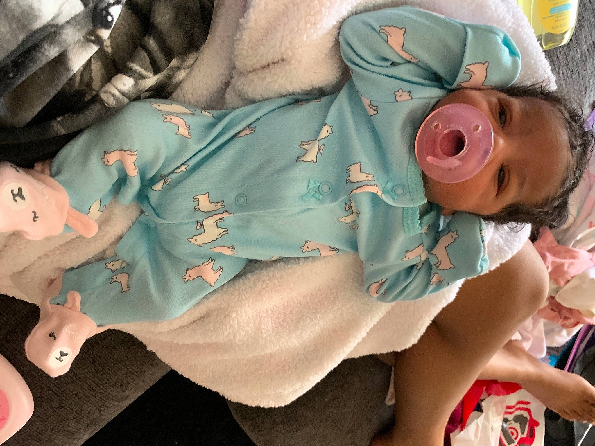 Damiyah is registered to the contest to win money with this photo: abdomen, baby, baby_products, chest, child, comfort, eyewear, human_body, human_leg, joint, leg, linens, mouth, nail, pattern, person, pink, stuffed_toy, sunglasses, thigh
