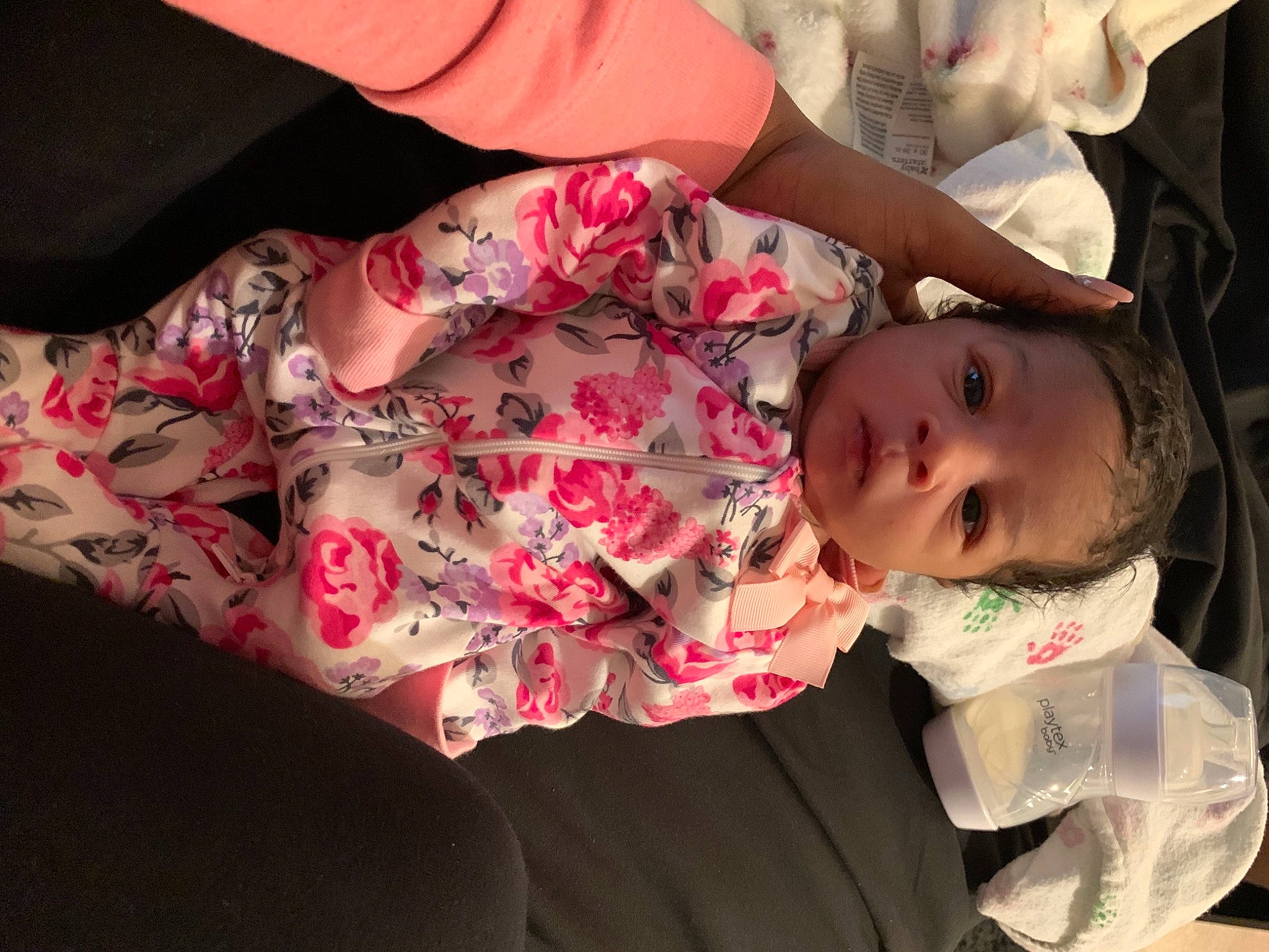Damiyah is registered to the contest to win money with this photo: arm, baby, baby_toddler_clothing, cheek, comfort, eye, face, facial_expression, finger, hand, happy, head, human_body, lip, mouth, person, pink, skin, sleeve, toddler