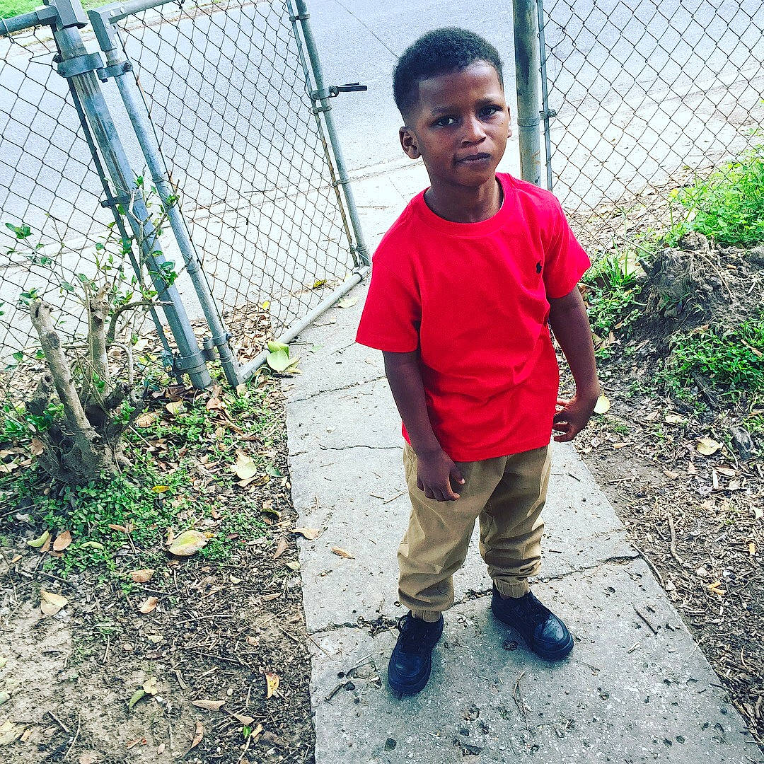 Lathan is registered to the contest to win money with this photo: adaptation, child, fun, jeans, male, person, plant, play, shoe, smile, t_shirt, toddler, tree, vacation