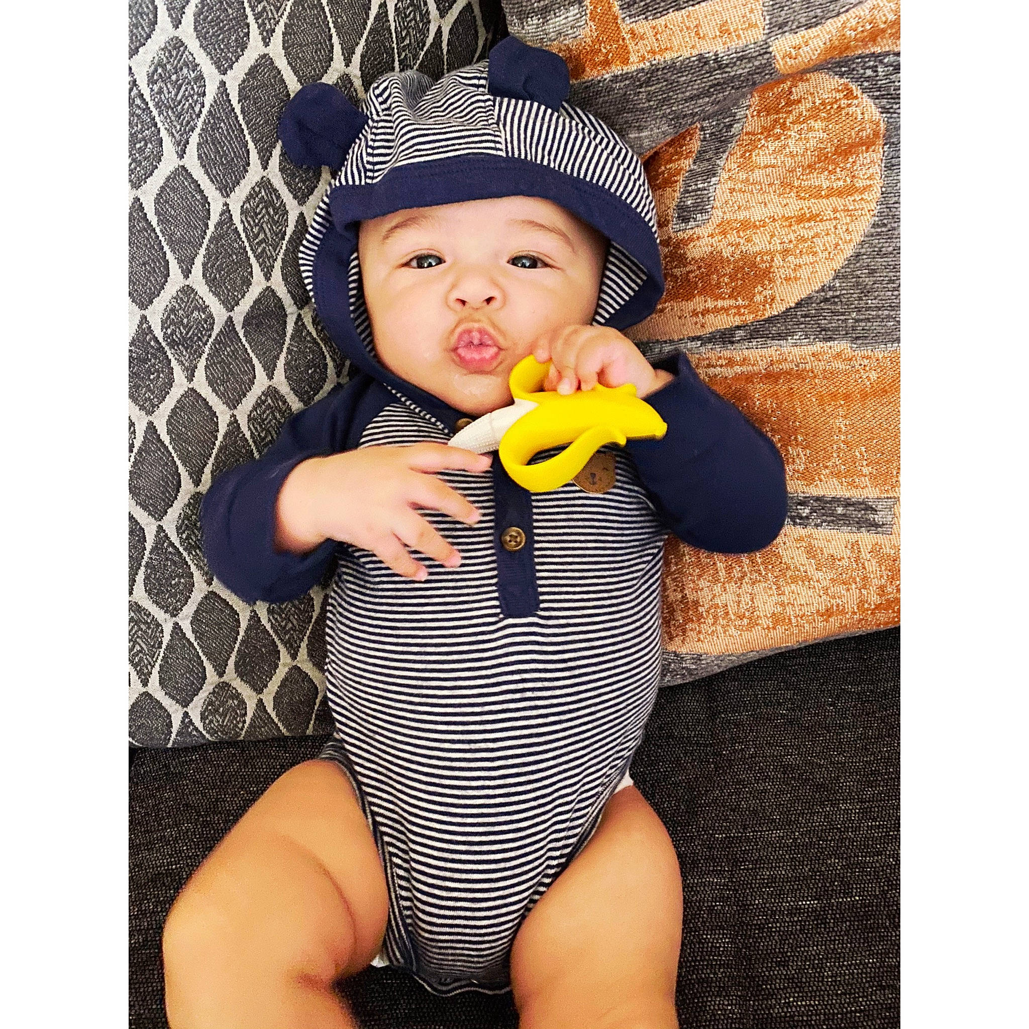 Cristiano is registered to the contest to win money with this photo: baby, baby_toddler_clothing, beanie, bonnet, cap, child, clothing, costume_accessory, hat, headgear, headwear, leg, person, photo_shoot, photography, plant, product, smile, swimwear, thigh