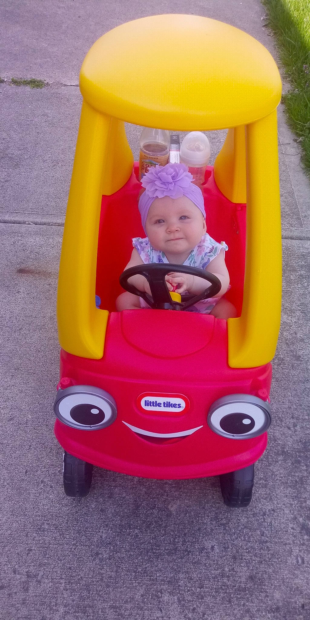 Lola is registered to the contest to win money with this photo: baby_products, baby_toys, child, fun, headwear, person, pink, play, playset, product, riding_toy, toddler, toy, yellow