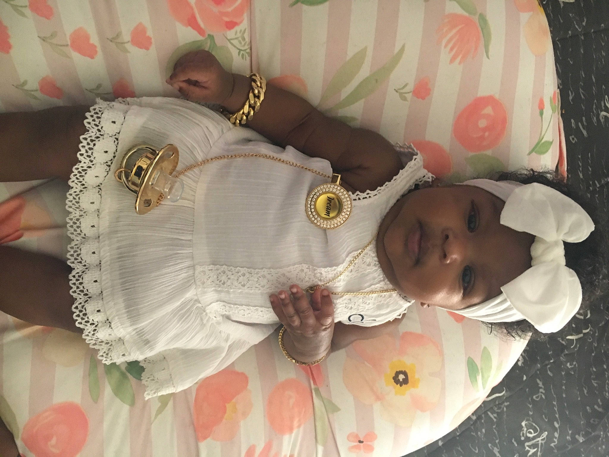 Jream is registered to the contest to win money with this photo: baby, baby_products, baby_toddler_clothing, bedding, child, comfort, fashion_accessory, head, headwear, human_body, linens, pattern, person, room, sleeve, textile, toddler, wrist