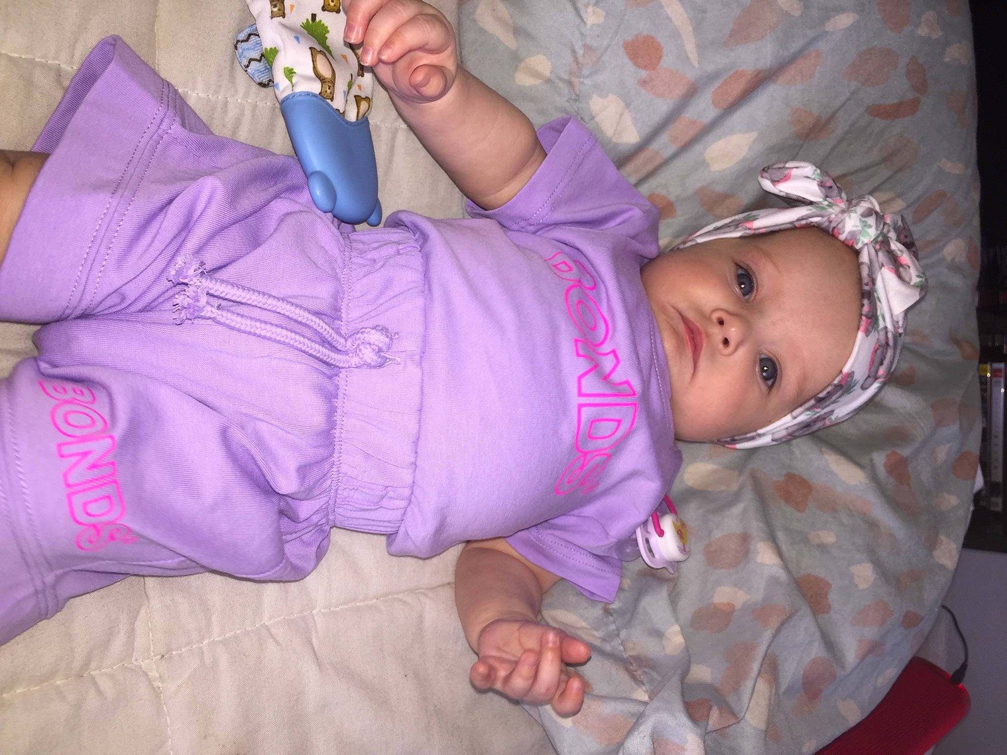 Alora-rose joined the competition — help win amazing prizes! baby, baby_products, baby_toddler_clothing, cheek, child, comfort, fun, headwear, magenta, mouth, nail, person, pink, purple, sitting, skin, sleeve, toddler, violet