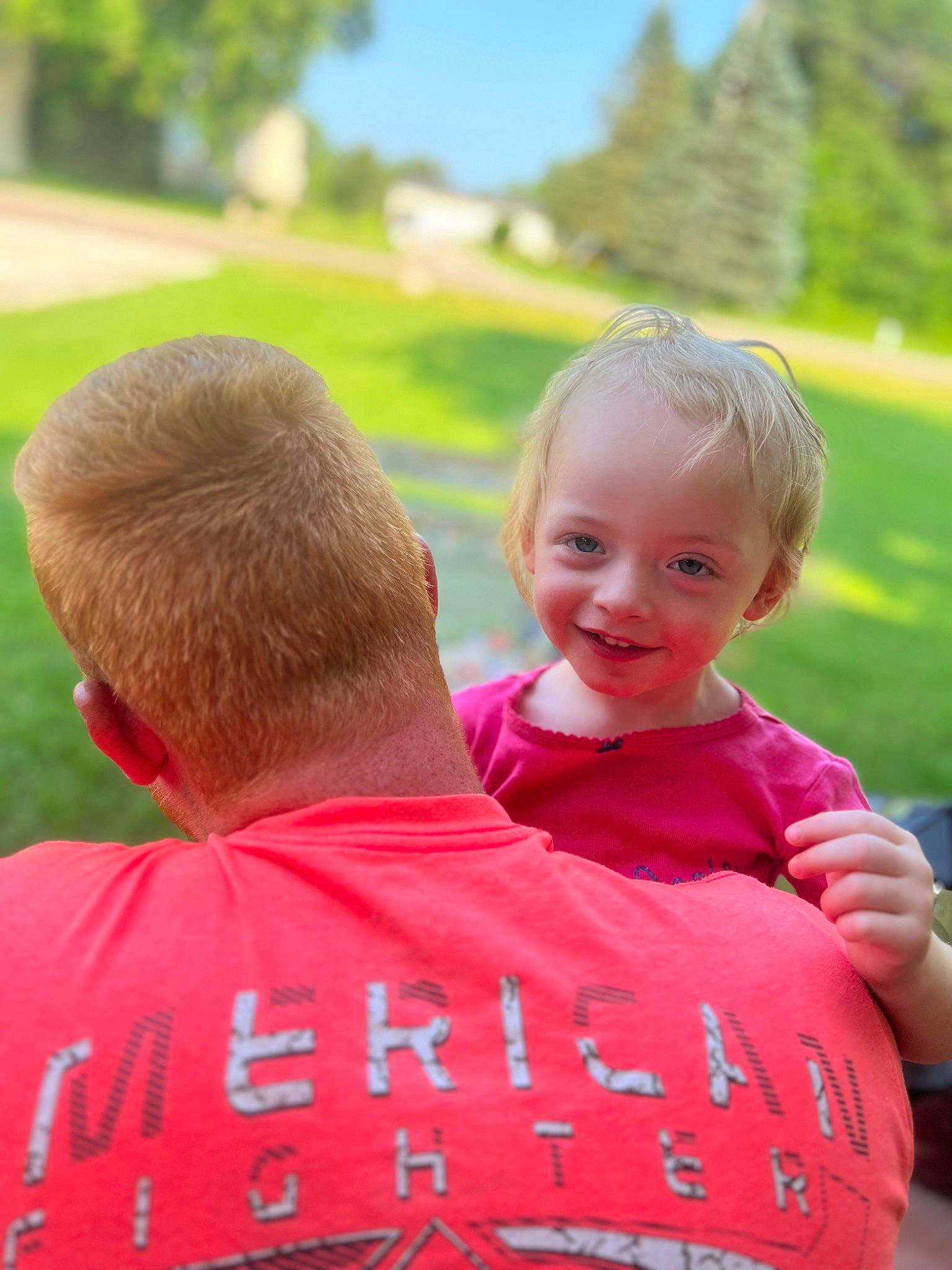 Brynleigh is registered to the contest to win money with this photo: baby, child, fun, gesture, grass, grassland, happy, hug, joy, lawn, leisure, people_in_nature, person, recreation, shoulder, sitting, sky, smile, t_shirt, toddler