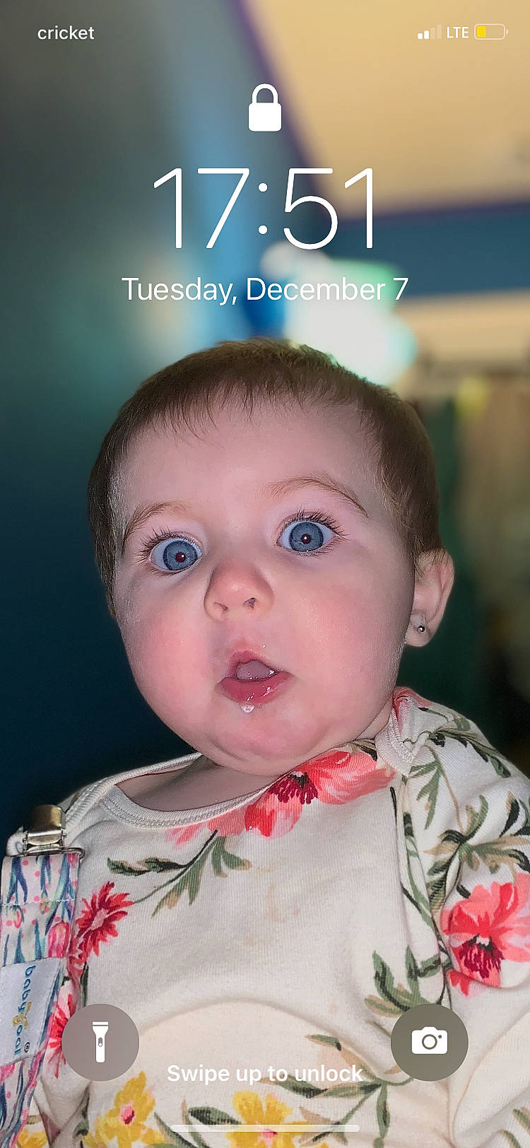 Harper is registered to the contest to win money with this photo: baby, baby_toddler_clothing, cheek, child, chin, dress, eye, eyelash, face, formal_wear, fun, happy, iris, nose, organ, person, skin, sleeve, standing, surprise