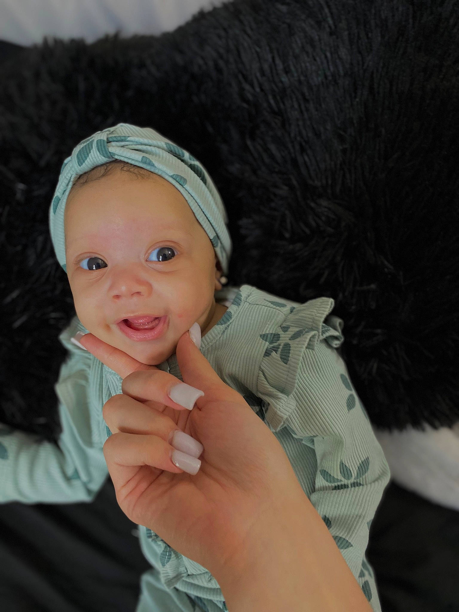 Zanova is registered to the contest to win money with this photo: baby, baby_toddler_clothing, beanie, cap, child, eyebrow, fashion_accessory, finger, flash_photography, fur, gesture, hand, happy, headwear, lip, nail, nose, person, skin, smile