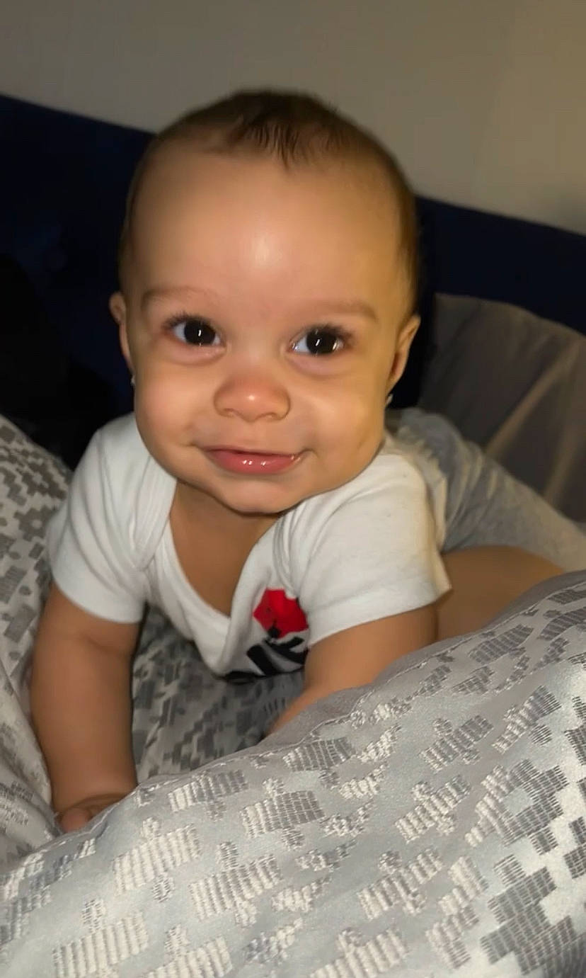 Zereem is registered to the contest to win money with this photo: baby, baby_toddler_clothing, cheek, child, comfort, eyebrow, flash_photography, flooring, fun, happy, iris, joy, lip, mammal, nose, person, room, sitting, skin, smile