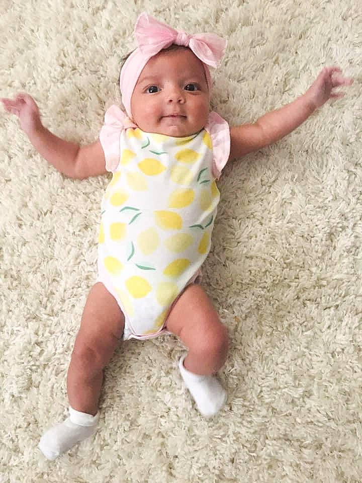 Camila is registered to the contest to win money with this photo: baby, baby_products, baby_toddler_clothing, child, headwear, pattern, person, pink, play, product, smile, toddler