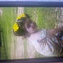 Emmy Ray is registered to the contest to win money with this photo: child, girl, yellow_bows, hair_accessories, grass, outdoor, squatting, smile, dress, patterned_dress, shoes, young_child, nature, daylight, portrait, cute, greenery, sunlight, happy, playful