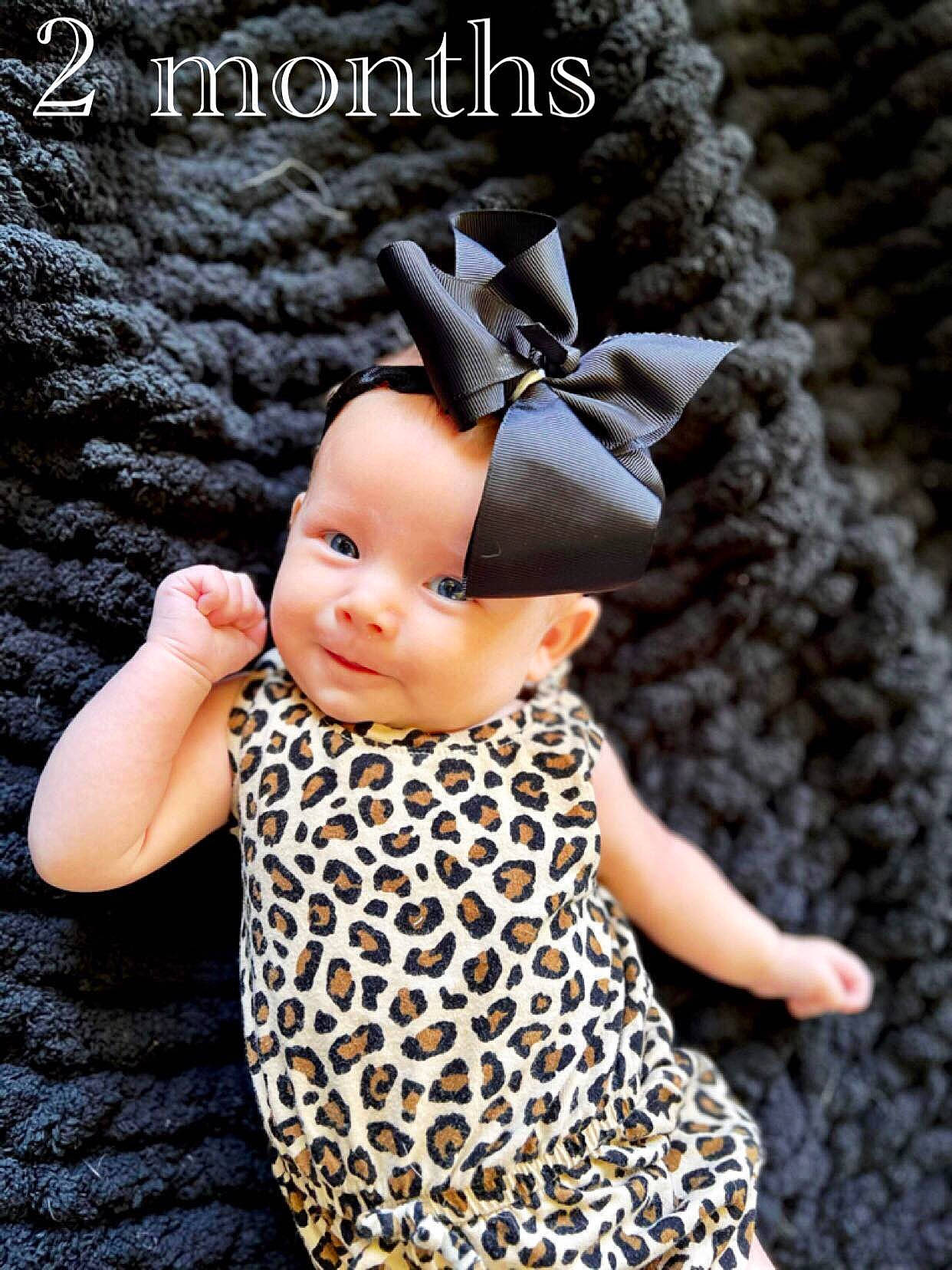 Lucky is registered to the contest to win money with this photo: art, baby_toddler_clothing, cap, child, costume_accessory, costume_hat, crochet, doll, eyelash, fashion_accessory, finger, font, fur, hair_accessory, jewellery, pattern, person, sleeve, toy, tree