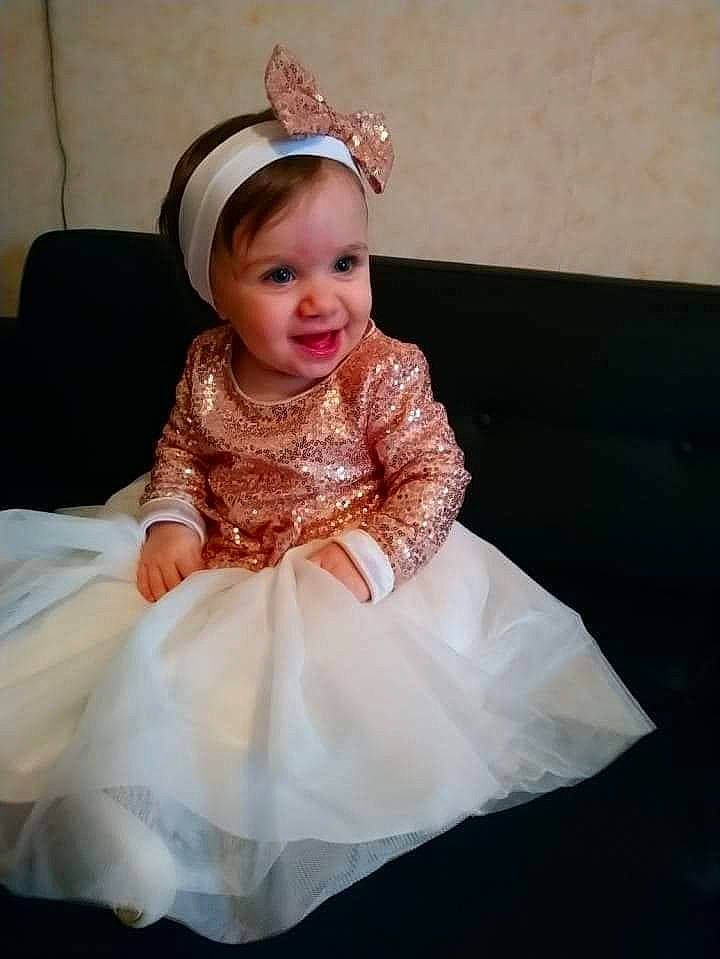 Abygaëlle a rejoint le concours — aidez-le/la à gagner de superbes lots ! baby, bridal_accessory, bridal_clothing, bridal_party_dress, child, clothing, costume, dress, fashion_accessory, flower_girl, formal_wear, gown, hair_accessory, headgear, headpiece, joy, person, toddler, wedding_dress, white