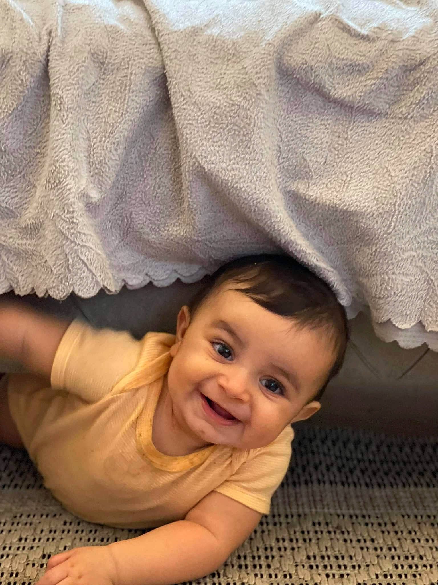 Léya participe au concours pour gagner de l'argent avec cette photo : baby, baby_toddler_clothing, cheek, comfort, dress, eye, eyebrow, face, facial_expression, flash_photography, floor, flooring, happy, iris, joy, nose, person, skin, smile, textile