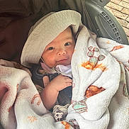 Wilder is registered to the contest to win money with this photo: baby, blanket, hat, stroller, infant, child, clothing, face, hand, pacifier, smile, cute, cozy, outdoor, seat, fabric, comfort, portrait, babywearing, soft