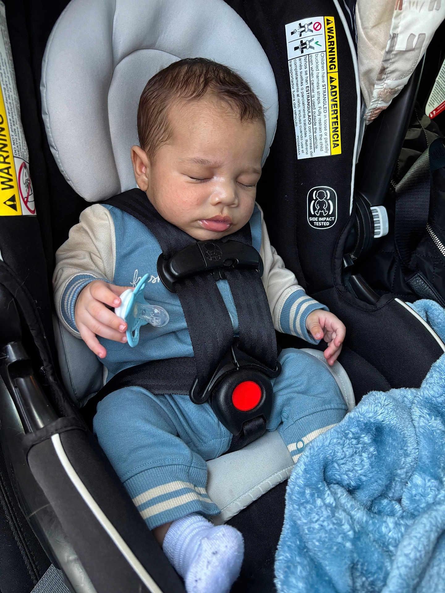 Kyaire joined the competition — help win amazing prizes! baby, sleeping, car_seat, pacifier, blue_outfit, sock, blanket, child, infant, safety_harness, warning_label, close_up, peaceful, indoor, person, seat, head, hand, comfort, rest