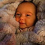 Alaina joined the competition — help win amazing prizes! baby, blanket, child, comfort, cozy, cute, expression, face, fur, head, infant, newborn, portrait, rest, skin, smile, snuggle, soft, warm, wrapped