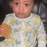 Nubian is registered to the contest to win money with this photo: advertisement, baby, bodypart, book, bread, cookie, cracker, cream, cutlery, dessert, face, finger, food, hand, head, person, photography, portrait, publication, sweets