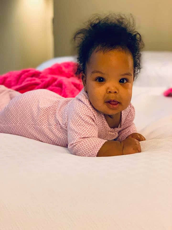 Xariya is registered to the contest to win money with this photo: baby, beauty, black_hair, cheek, child, chin, daughter, eye, face, forehead, happy, head, lip, mouth, nose, person, pink, room, skin, smile