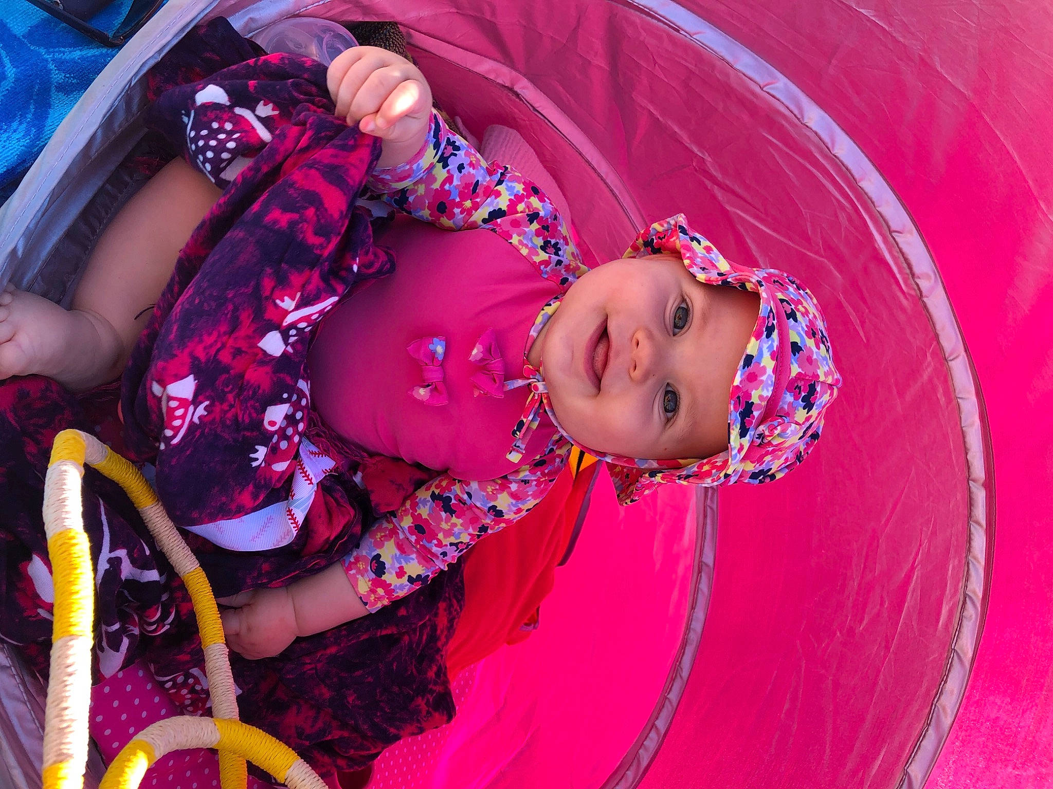 Andrésine a rejoint le concours — aidez-le/la à gagner de superbes lots ! baby, baby_products, baby_toddler_clothing, child, dress, event, fun, happy, headwear, joy, leisure, magenta, pattern, peach, person, pink, purple, sitting, smile, textile