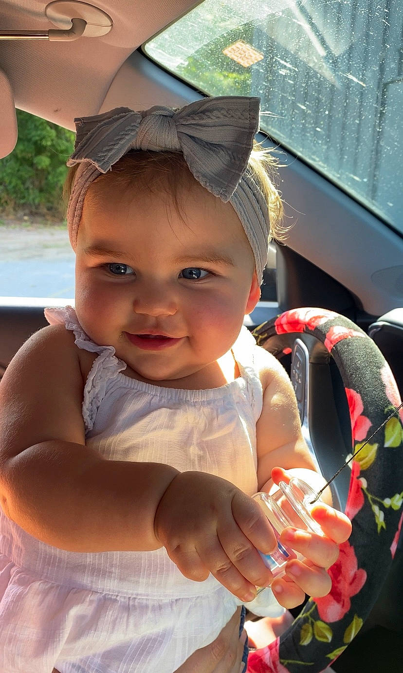 Amaya joined the competition — help win amazing prizes! baby, baby_products, baby_toddler_clothing, baseball_cap, cap, child, chin, face, fashion_accessory, finger, fun, gesture, grass, happy, lip, nail, person, skin, smile, thumb