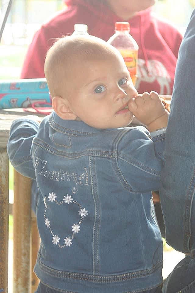 Azlynn is registered to the contest to win money with this photo: baby, cheek, child, ear, forehead, hair, hairstyle, jeans, person, product, sitting, skin, smile, toddler