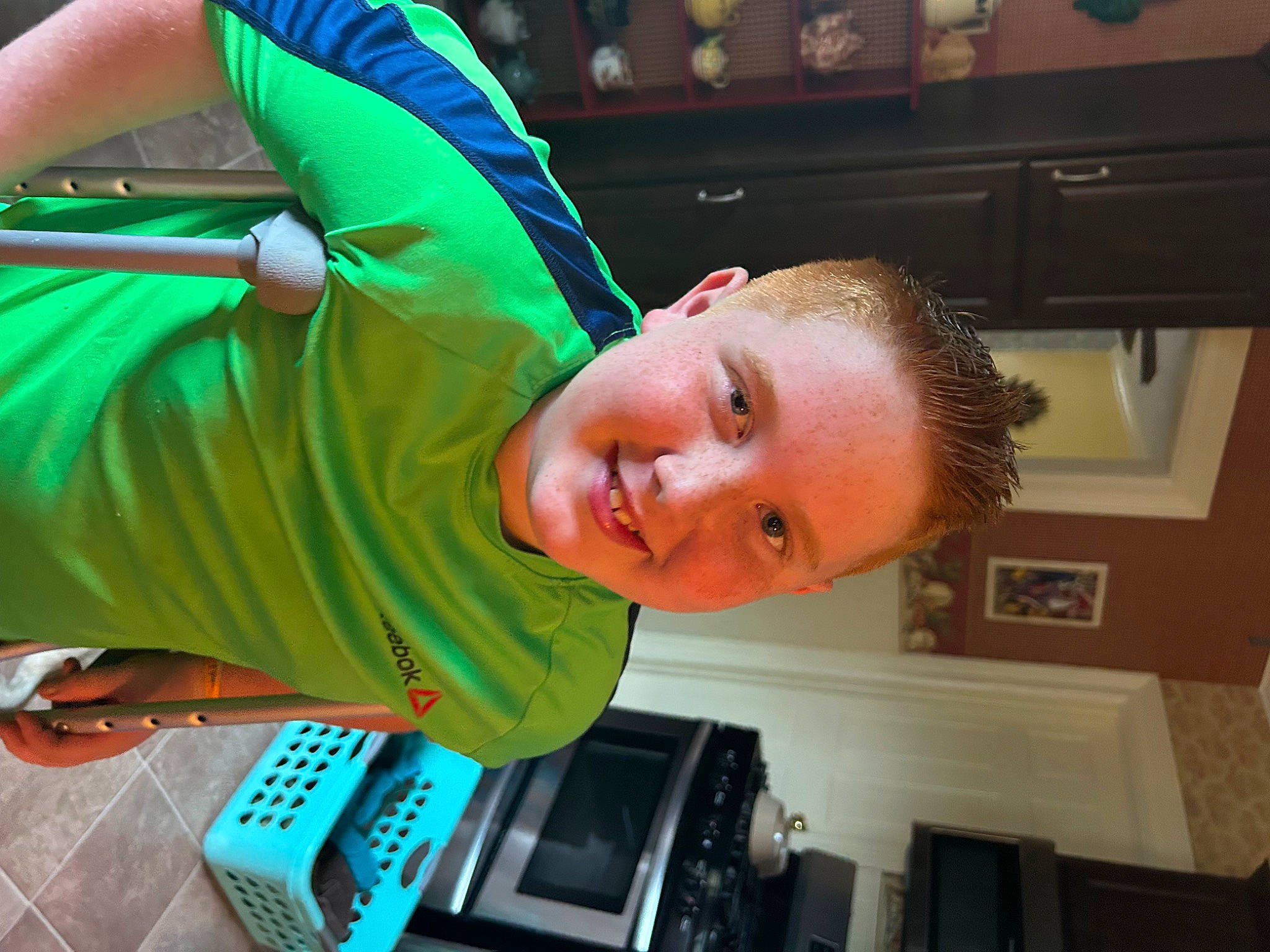 Colten is registered to the contest to win money with this photo: child, elbow, fun, home_appliance, joy, kitchen_appliance, leisure, machine, person, picture_frame, room, t_shirt