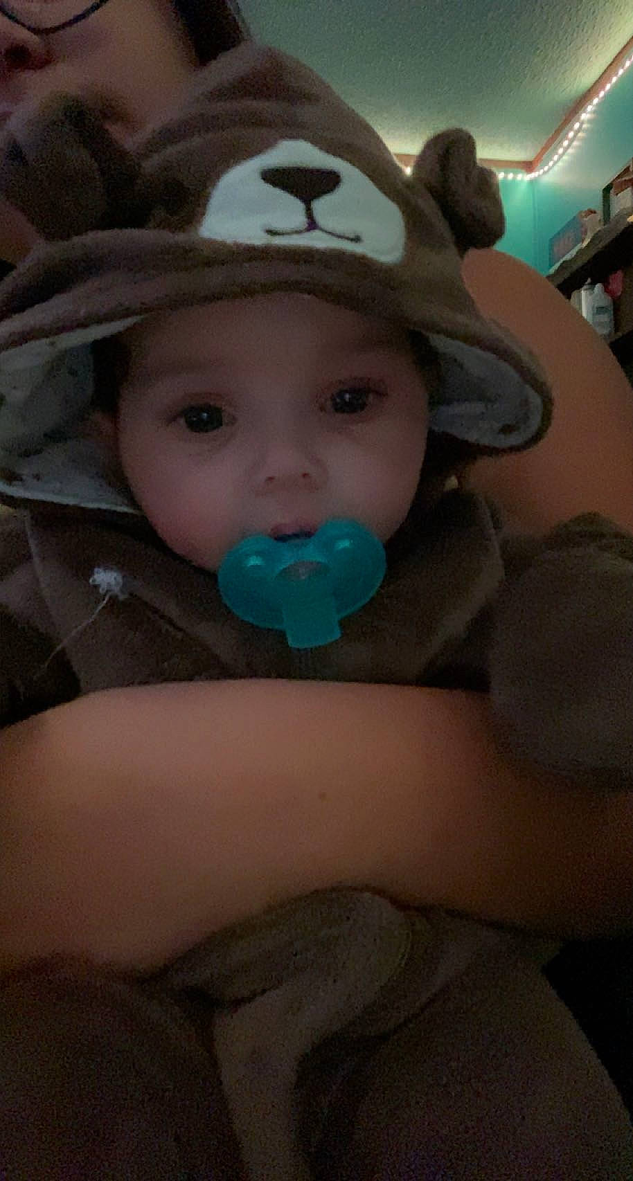 Mallory is registered to the contest to win money with this photo: arm, baby, baby_products, baby_toddler_clothing, cap, cheek, comfort, eye, eyebrow, fedora, happy, headwear, human_body, iris, mouth, nose, person, skin, sun_hat, textile