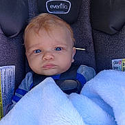 Theo joined the competition — help win amazing prizes! baby, baby_boy, blanket, blue_eyes, car_seat, child, close_up, clothing, cute, expression, face, head, indoor, infant, person, portrait, seatbelt, security, soft_texture, young_child