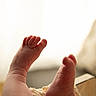 Anaë participe au concours pour gagner de l'argent avec cette photo : baby, feet, toes, close_up, skin, infant, soft, lace, fabric, resting, newborn, cute, small, warm_light, backlit, cozy, human, limbs, tender, detail