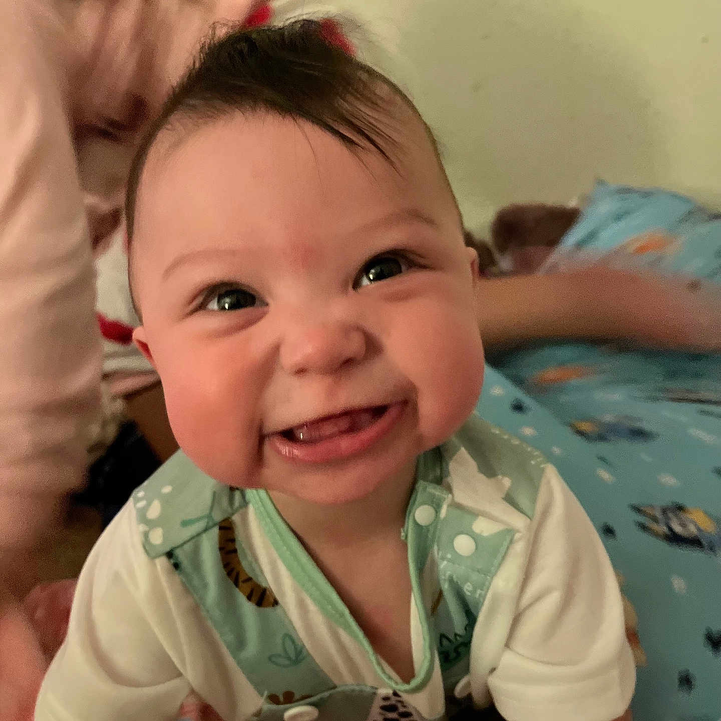 Jace is registered to the contest to win money with this photo: baby, smile, child, infant, cute, happy, face, person, indoor, clothing, pattern, playful, young_child, closeup, expression, joyful, eyes, mouth, skin, hair