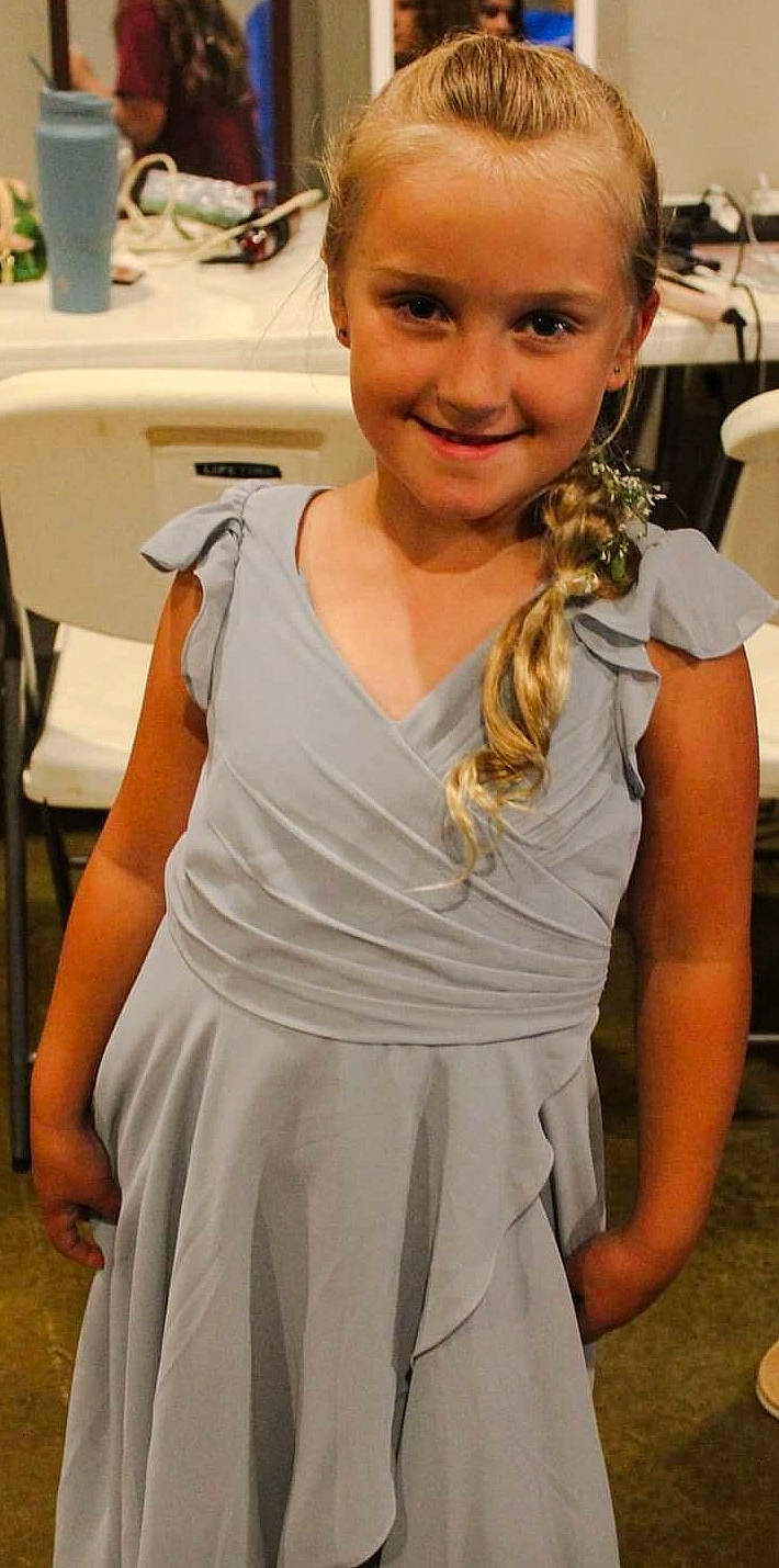 Kinlee joined the competition — help win amazing prizes! blond, chair, child, day_dress, event, face, facial_expression, fashion_design, hair, hairstyle, happy, jewellery, joy, long_hair, neck, necklace, one_piece_garment, person, sleeve, sleeveless_shirt