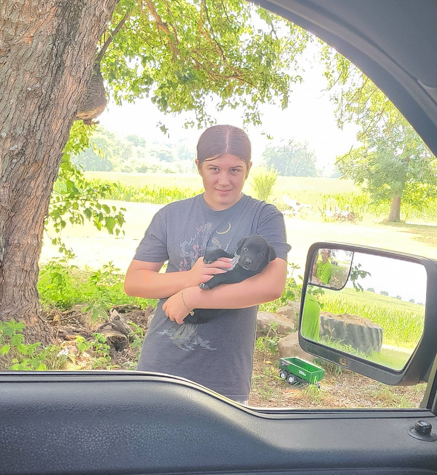 Elaina is registered to the contest to win money with this photo: automotive_design, automotive_exterior, automotive_mirror, car, eyewear, glass, grass, green, hat, headwear, hood, joy, motor_vehicle, person, plant, rear_view_mirror, shade, smile, tints_and_shades, tree