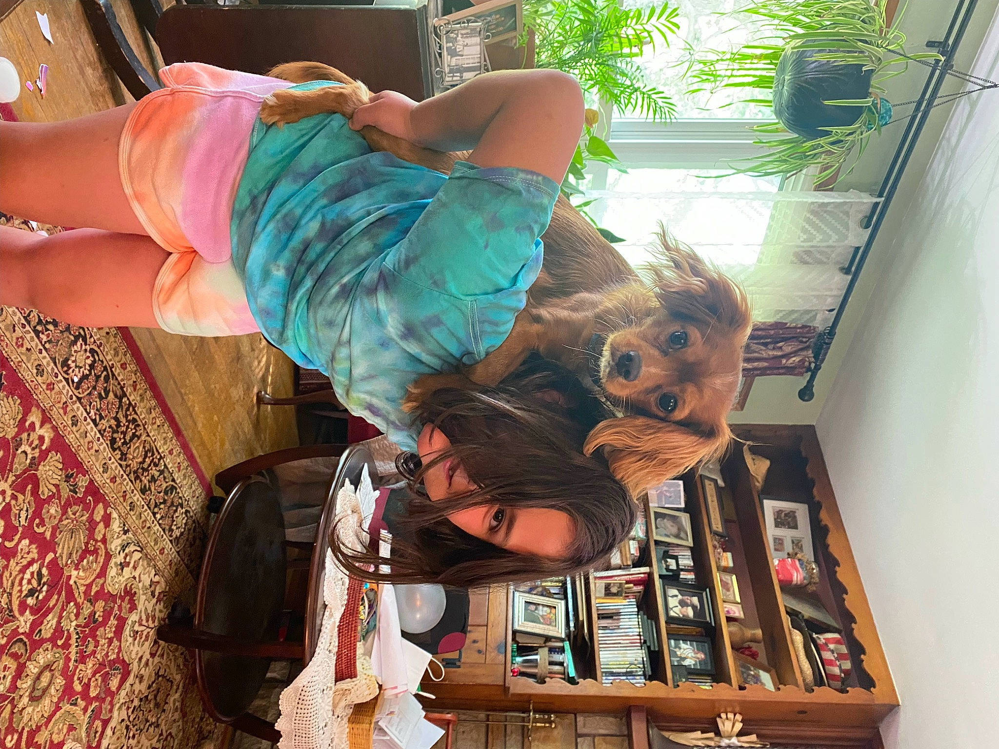 Clifford joined the competition — help win amazing prizes! arm, bookcase, clothing, dress, elbow, eyewear, fun, happy, human_leg, leg, leisure, room, shelf, shelving, sitting, sunglasses, thigh, tree, waist, wrist