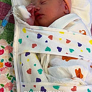 Emerley joined the competition — help win amazing prizes! newborn, baby, infant, sleeping, hospital, medical, blanket, cap, iv, hand, face, bed, colorful, pattern, heart, patient, cute, wrapped, resting, healthcare