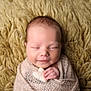 newborn, baby, sleeping, wrapped, blanket, heart, plush, soft, texture, face, peaceful, cute, infant, skin, hand, portrait, closeup, cozy, warm, resting