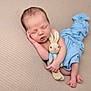 newborn, baby, sleeping, plush_toy, bunny, blanket, blue_blanket, couch, soft_texture, peaceful, infant, child, resting, cute, toddler, wrapped, cozy, portrait, indoor, human