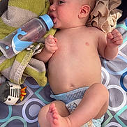 Bowen joined the competition — help win amazing prizes! baby, infant, baby_bottle, diaper, towel, blanket, plush_toy, play_mat, hat, face, ear, hand, foot, belly, skin, lying_down, pattern, feeding, cute, relaxing
