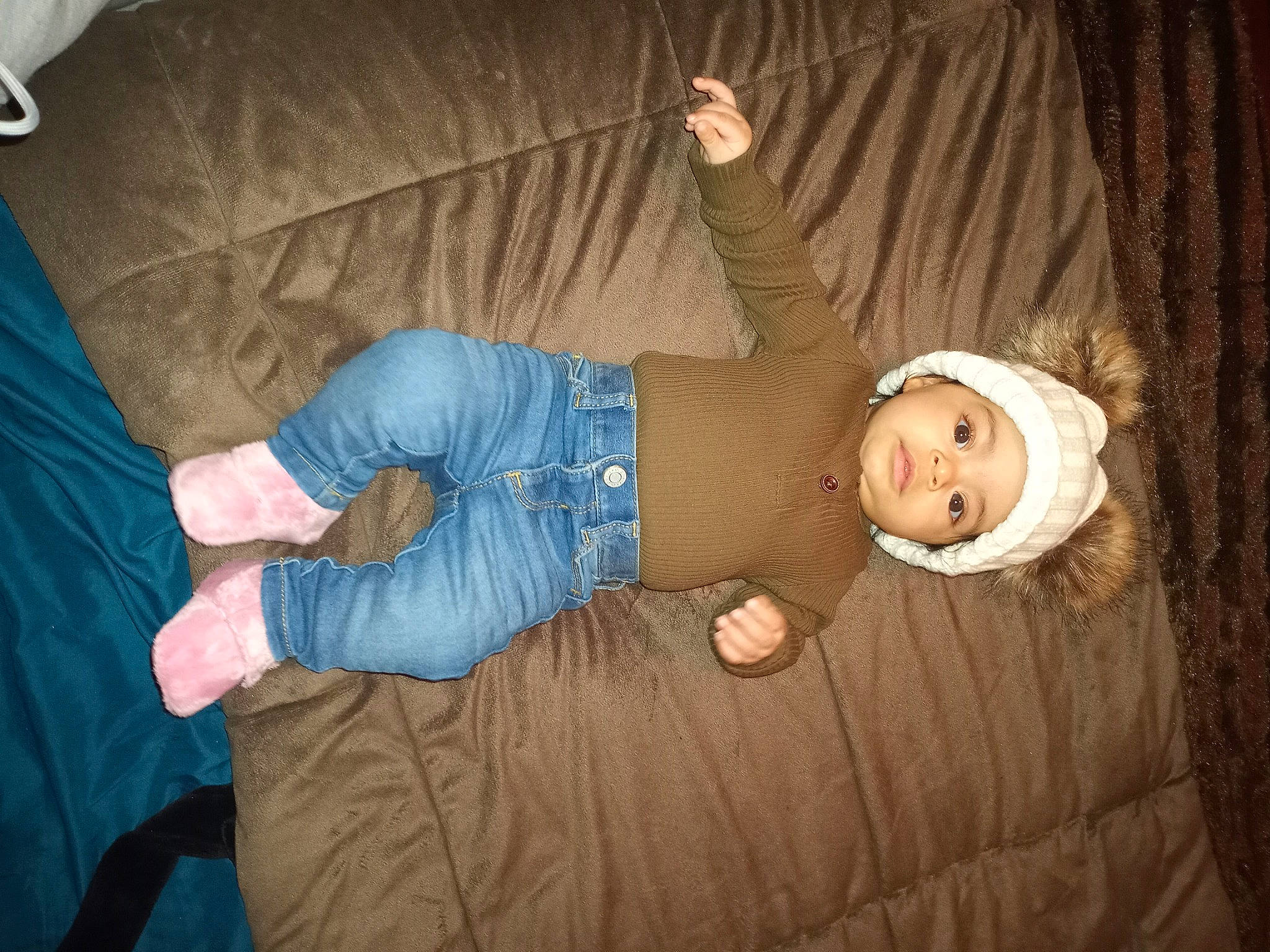 Ocean is registered to the contest to win money with this photo: baby_toddler_clothing, beanie, comfort, couch, curtain, denim, elbow, finger, flash_photography, hand, headwear, lap, person, thumb, wrist