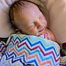 Aurora joined the competition — help win amazing prizes! newborn, baby, sleeping, infant, face, portrait, blanket, swaddled, cozy, indoors, couch, soft, colorful, chevron_pattern, peaceful, resting, closed_eyes, pink_clothing, photography, cute