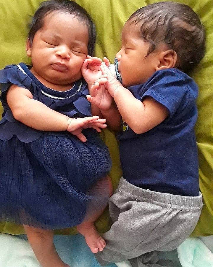 Kail'Ahni is registered to the contest to win money with this photo: arm, baby, cheek, child, daughter, finger, gesture, happy, hug, interaction, mother, nose, person, sibling, smile, thumb, toddler