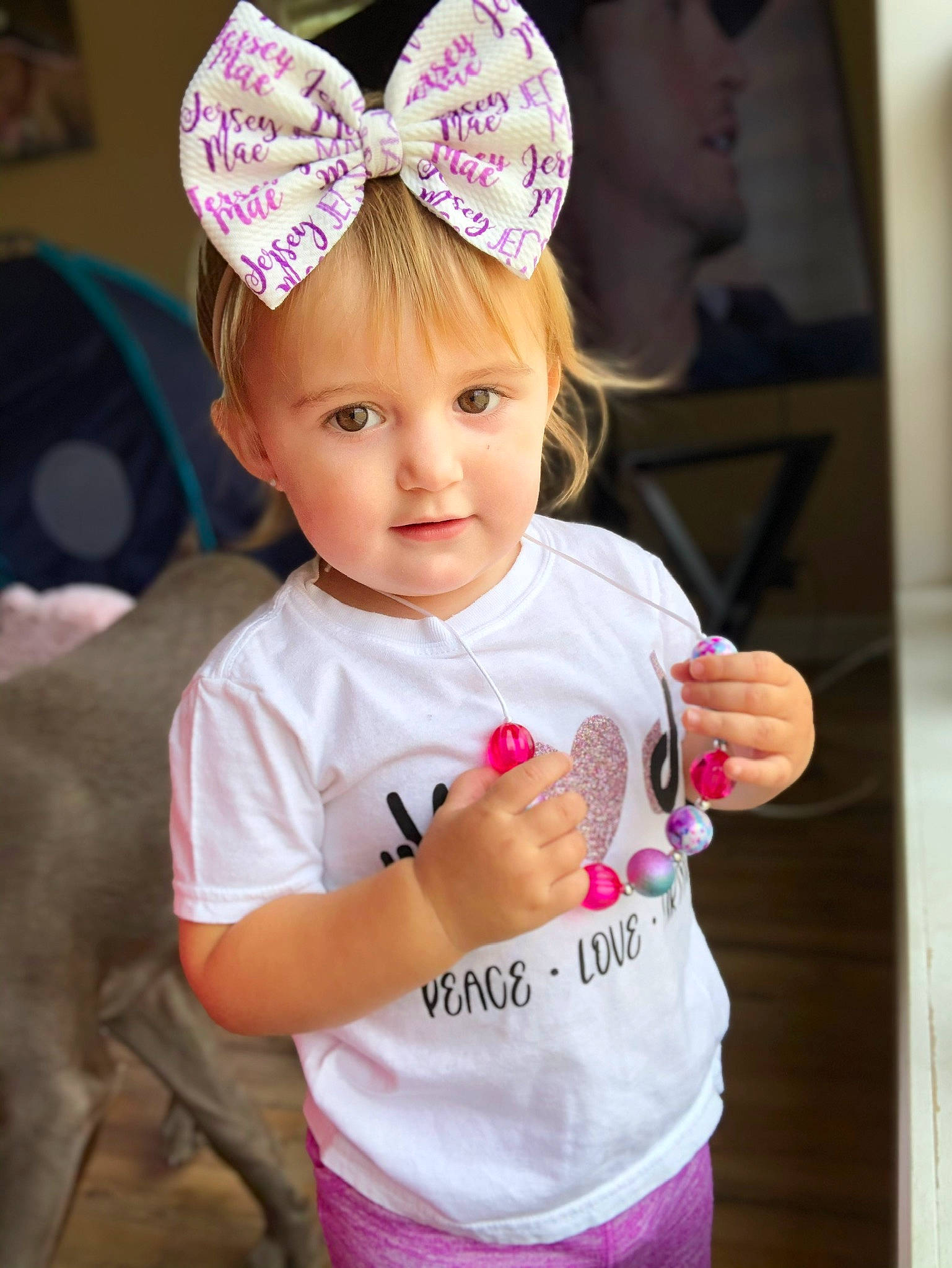 Jersey is registered to the contest to win money with this photo: baby, baby_toddler_clothing, child, child_model, clothing, costume_accessory, ear, fashion_accessory, hair_accessory, head, headband, headgear, organ, person, pink, product, skin, toddler