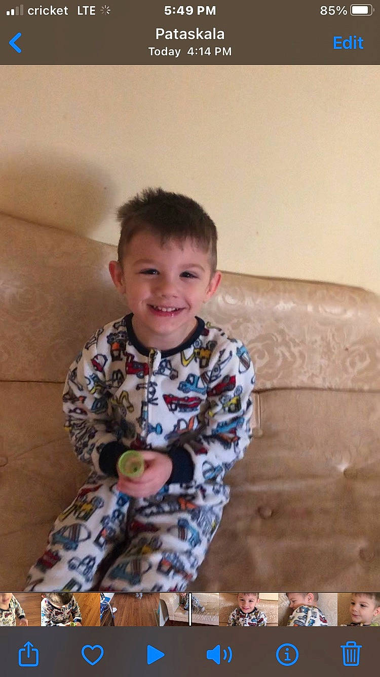 Slayde is registered to the contest to win money with this photo: baby_toddler_clothing, child, comfort, couch, facial_expression, flooring, fun, hairstyle, happy, human_body, joy, pattern, person, play, room, sitting, sleeve, smile, standing, t_shirt