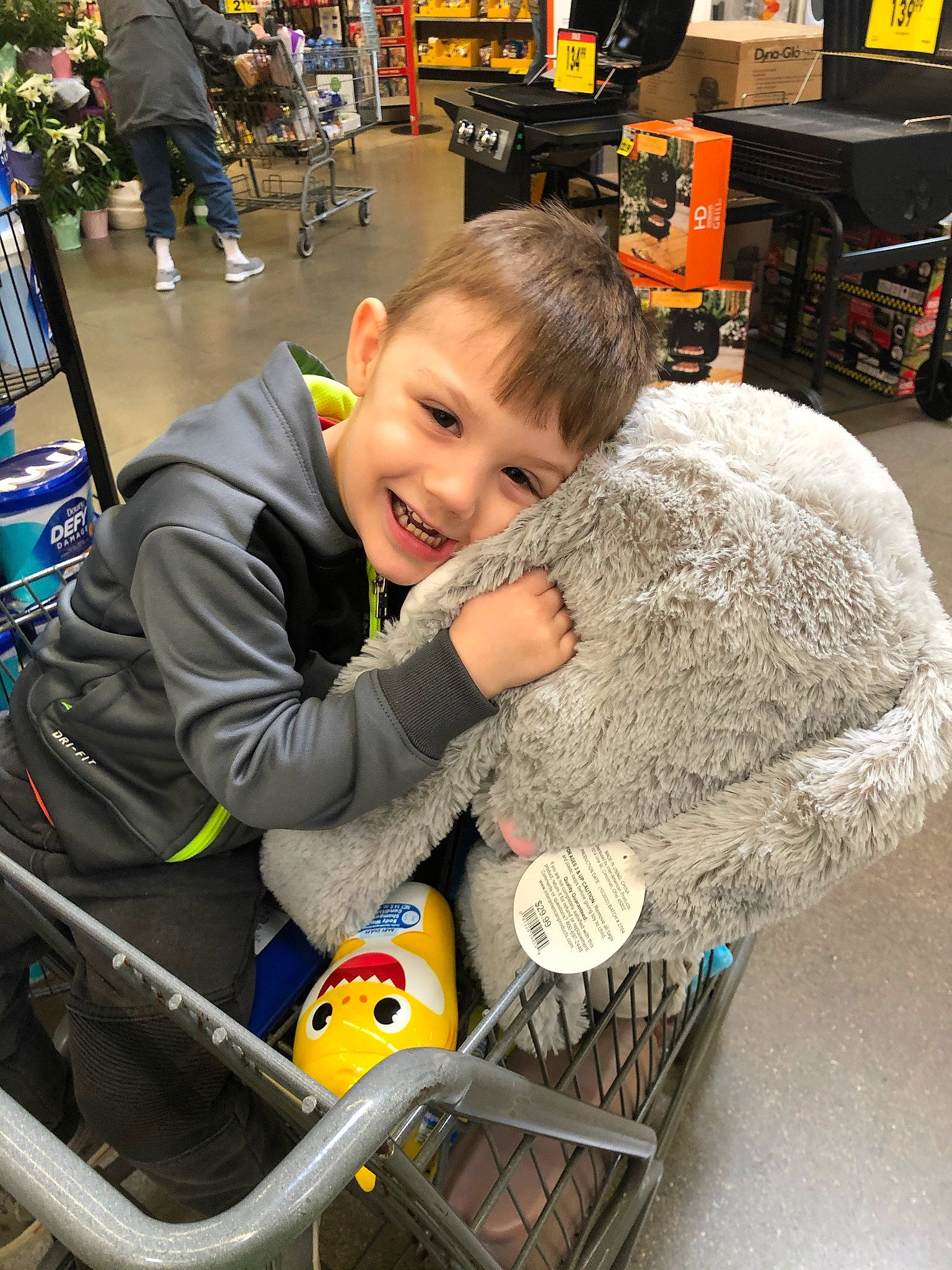 Slayde is registered to the contest to win money with this photo: baby, bag, chair, child, event, flooring, fun, fur, joy, leisure, luggage_and_bags, motor_vehicle, person, product, recreation, shopping_cart, sitting, smile, tire, toddler