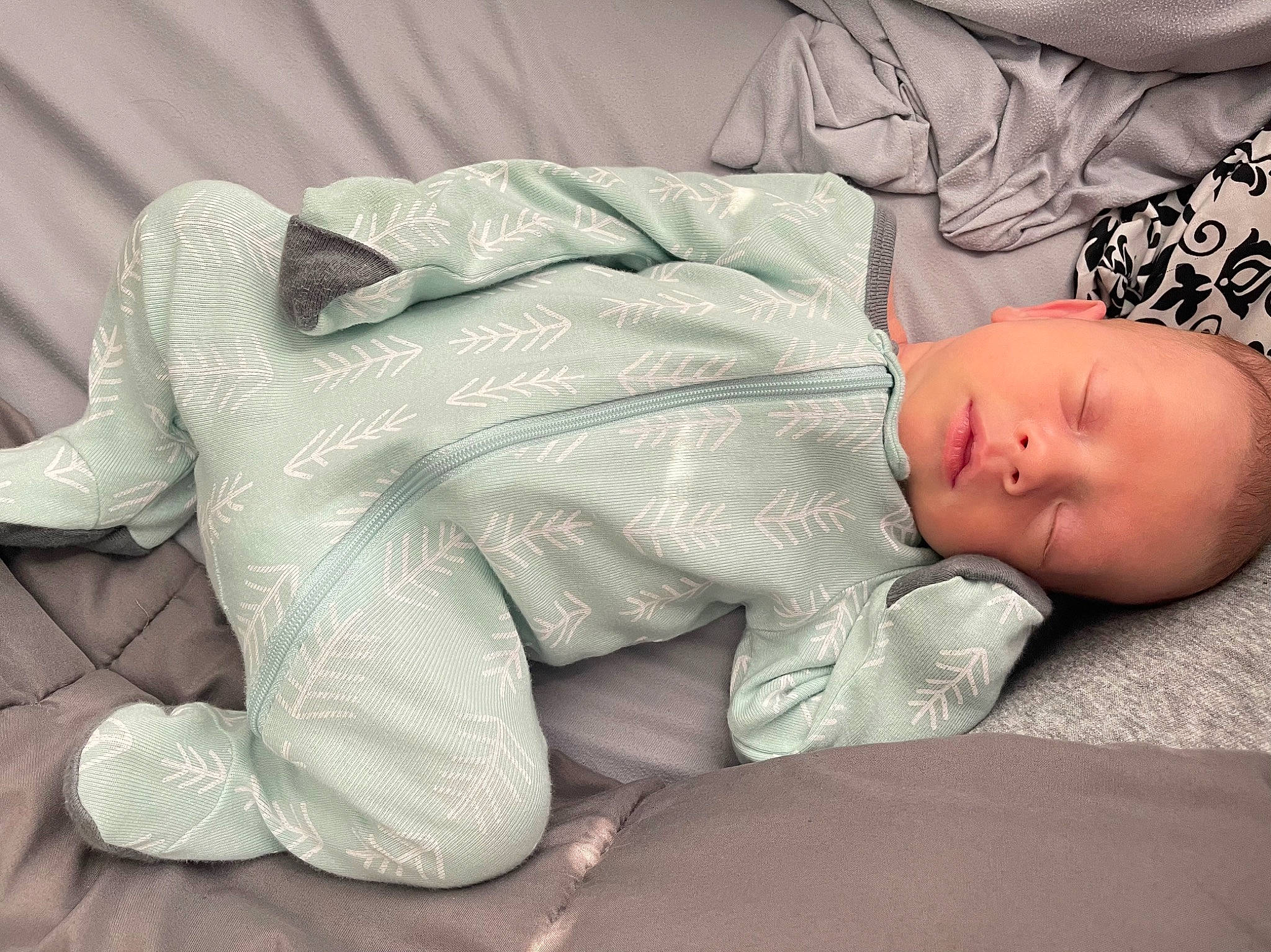 Cayden is registered to the contest to win money with this photo: baby, baby_products, baby_sleeping, baby_toddler_clothing, bedtime, child, comfort, elbow, foot, human_body, human_leg, knee, linens, nap, pattern, person, room, sitting, sleep, sleeve