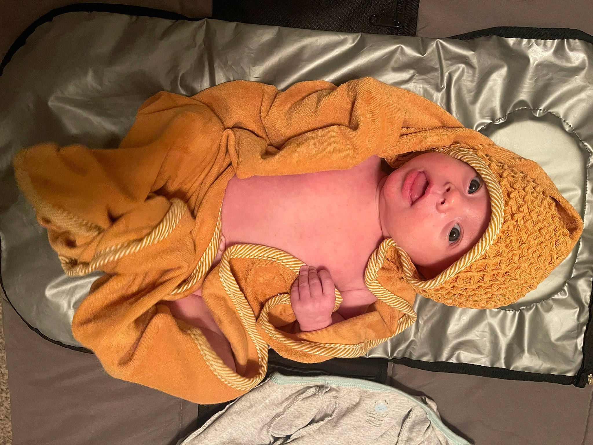 Cayden joined the competition — help win amazing prizes! baby, baby_products, baby_sleeping, baby_toddler_clothing, bed, bedding, bedtime, blanket, child, comfort, fawn, headgear, headwear, linens, nap, orange, peach, person, room, sleep